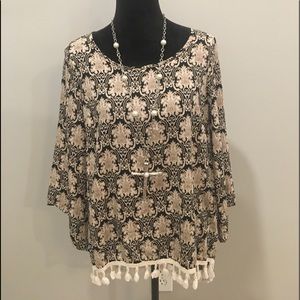 Boutique top black and cream with tassel design.